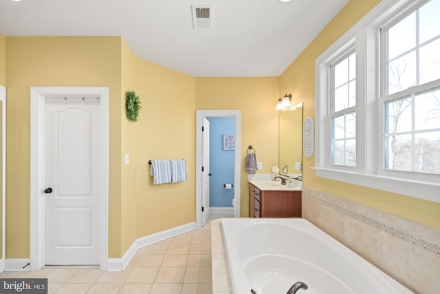 4108 Brushfield Dr, Frederick, MD 21704 - full bath with a garden tub, vanity, tile patterned floors, and baseboards