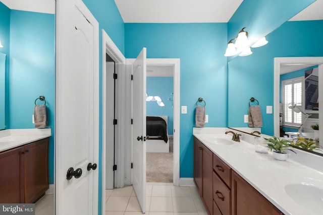 4108 Brushfield Dr, Frederick, MD 21704 - ensuite bathroom featuring tile patterned flooring, double vanity, and baseboards