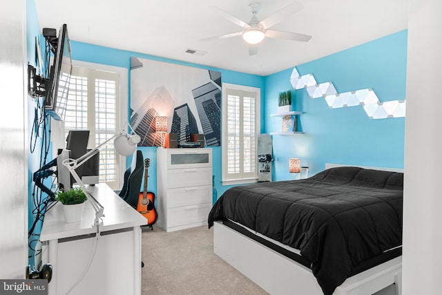 4108 Brushfield Dr, Frederick, MD 21704 - bedroom with light colored carpet, multiple windows, and a ceiling fan