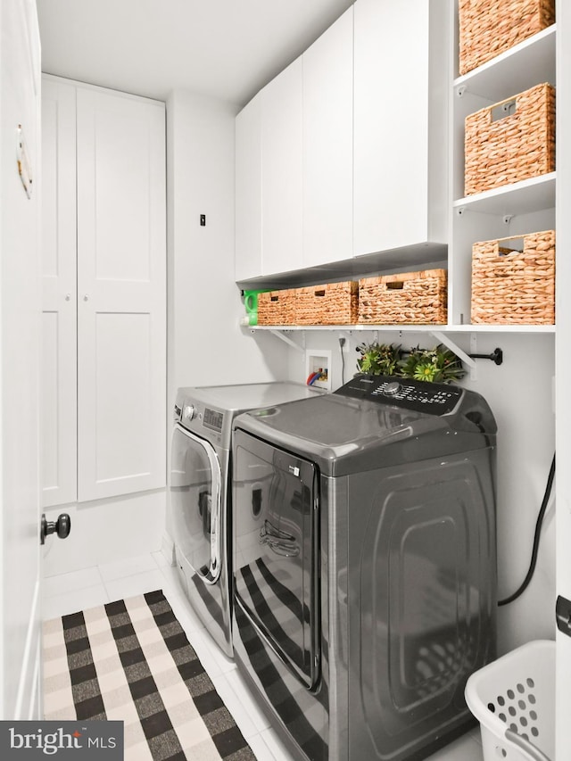 4108 Brushfield Dr, Frederick, MD 21704 - clothes washing area featuring cabinet space and separate washer and dryer