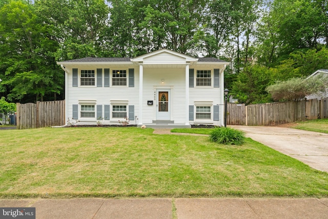 bi-level home featuring concrete driveway