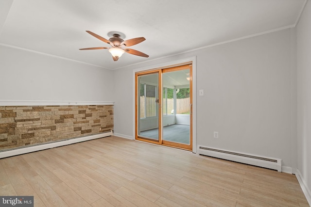 empty room featuring a baseboard heating unit, a ceiling fan, wood finished floors, ornamental molding, and baseboards