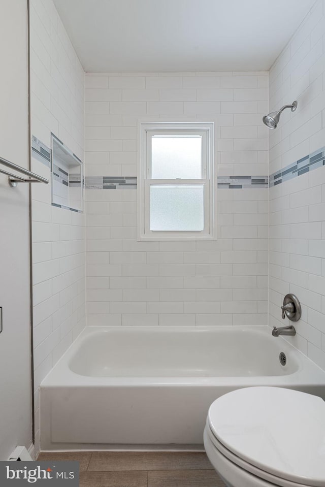full bathroom with bathtub / shower combination and toilet