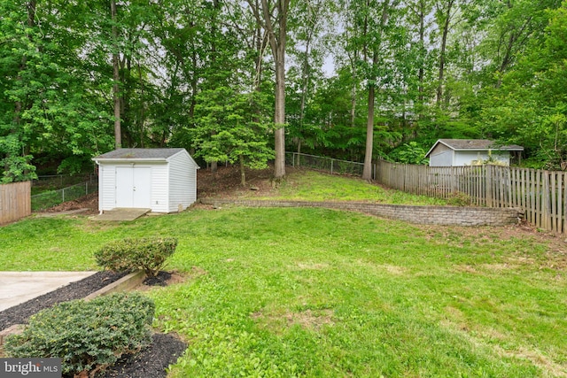 view of yard with a storage shed and an outdoor structure