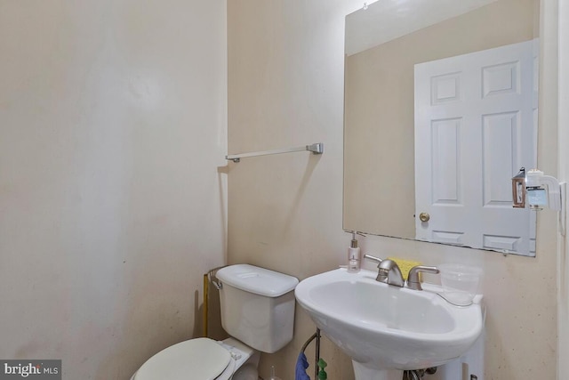 bathroom with a sink and toilet