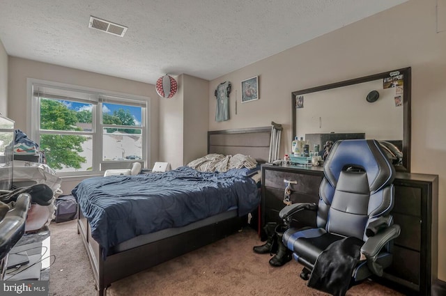 carpeted bedroom featuring a textured ceiling