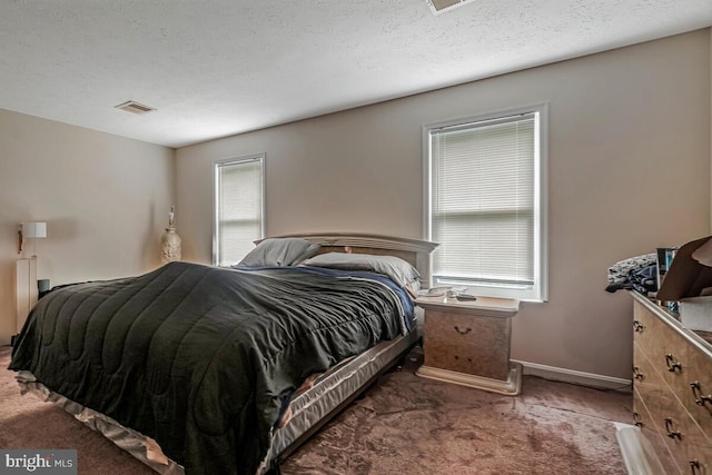 carpeted bedroom with baseboards