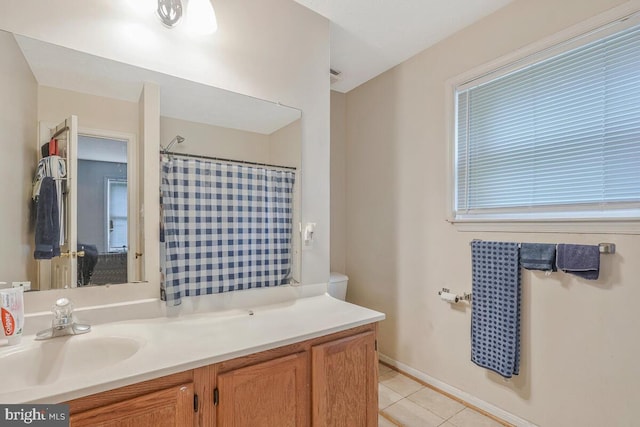 bathroom featuring tile patterned flooring, a shower with shower curtain, and vanity