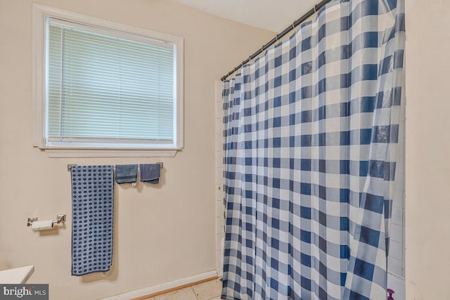 bathroom featuring tile patterned floors and a shower with shower curtain
