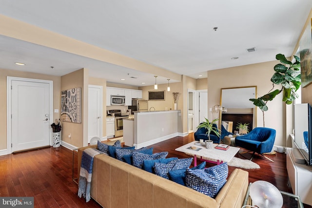 1811 Chestnut St Unit 405, Philadelphia, PA 19103 - living area with dark wood finished floors, baseboards, and recessed lighting