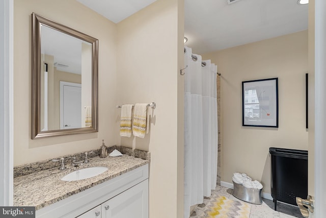 1811 Chestnut St Unit 405, Philadelphia, PA 19103 - bathroom with vanity, baseboards, and curtained shower