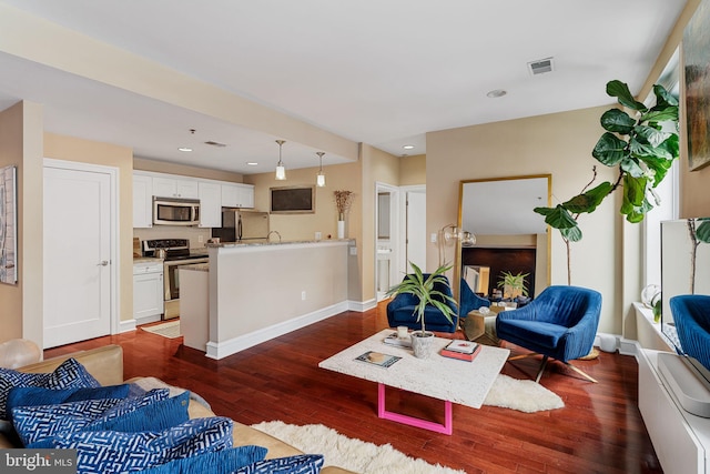 1811 Chestnut St Unit 405, Philadelphia, PA 19103 - living room with dark wood-style flooring, recessed lighting, and baseboards