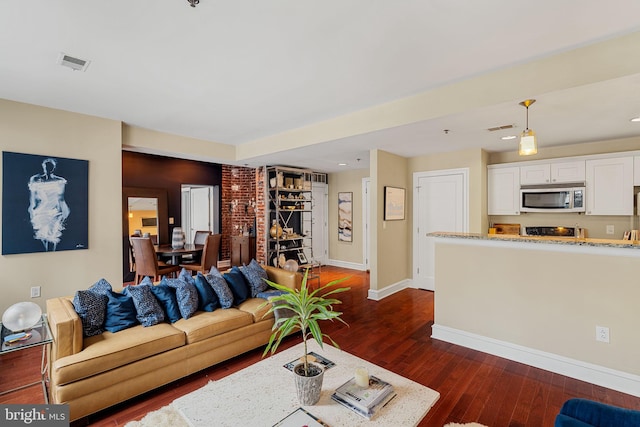 1811 Chestnut St Unit 405, Philadelphia, PA 19103 - living area featuring baseboards, dark wood-style floors, and recessed lighting