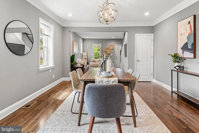 dining room featuring baseboards, a chandelier, crown molding, dark wood-style flooring, and recessed lighting