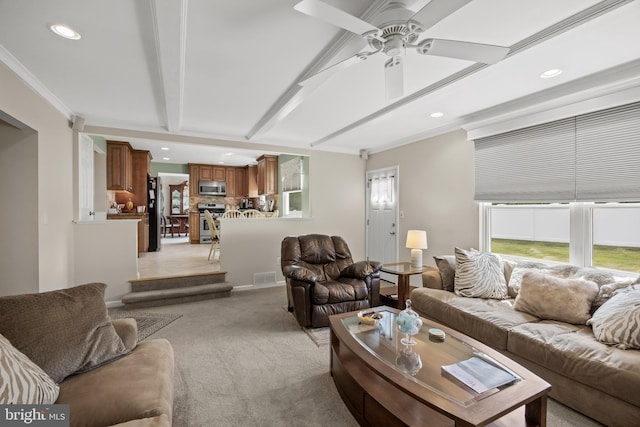 living area with light carpet, recessed lighting, a ceiling fan, and ornamental molding