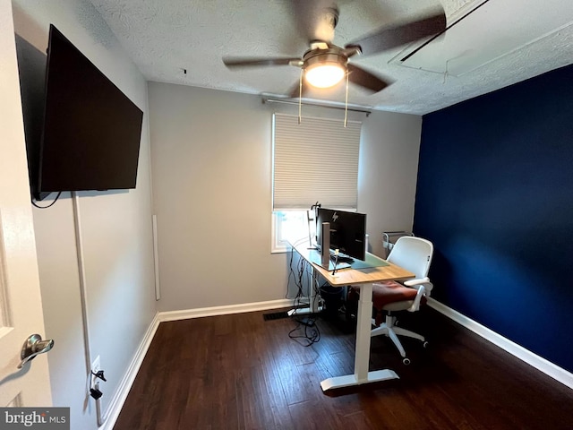 office with wood finished floors, a ceiling fan, attic access, baseboards, and a textured ceiling