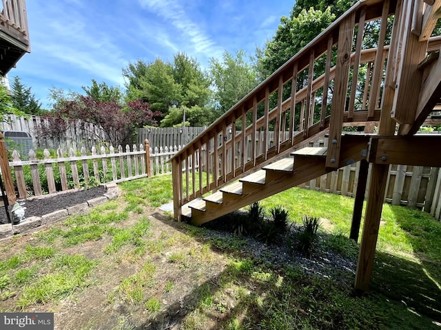 fenced backyard with stairway