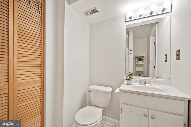 146 Connery Ter SW, Leesburg, VA 20175 - bathroom featuring toilet, a closet, vanity, baseboards, and tile patterned floors