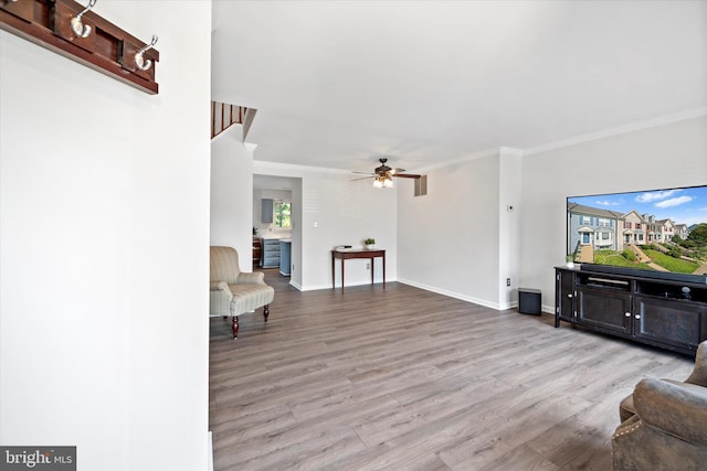 146 Connery Ter SW, Leesburg, VA 20175 - living room with ornamental molding, wood finished floors, ceiling fan, and baseboards
