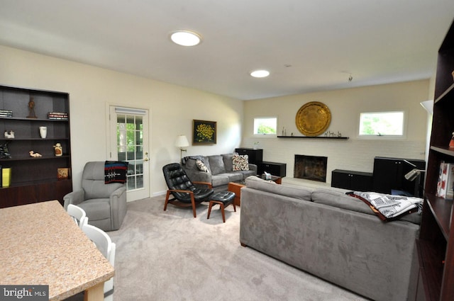 living room featuring a fireplace, carpet, plenty of natural light, and recessed lighting