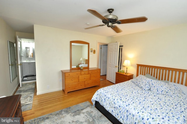 bedroom featuring wood finished floors, baseboards, and ceiling fan