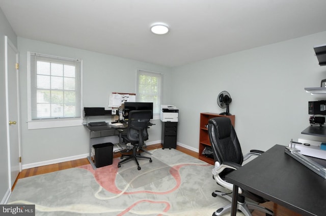 office space featuring wood finished floors and baseboards