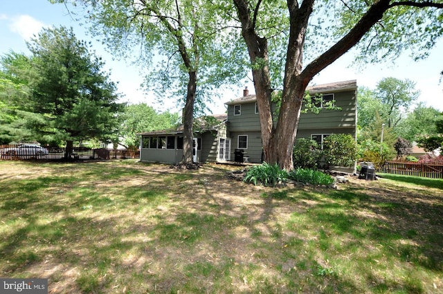view of yard featuring a sunroom