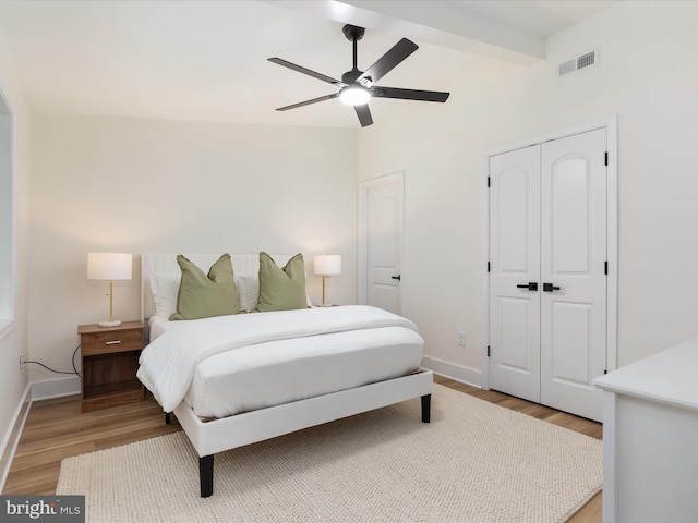 139 Laura Ct, Basye, VA 22810 - bedroom with light wood-style floors, a closet, lofted ceiling, baseboards, and a ceiling fan