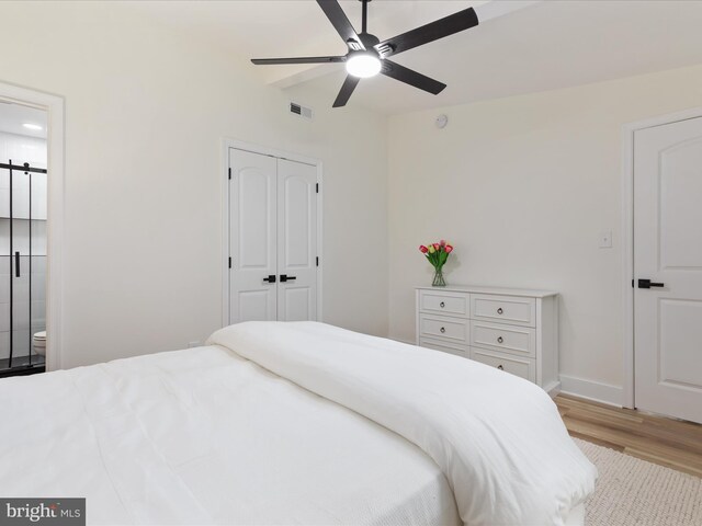 139 Laura Ct, Basye, VA 22810 - bedroom with wood finished floors, a closet, baseboards, ceiling fan, and connected bathroom