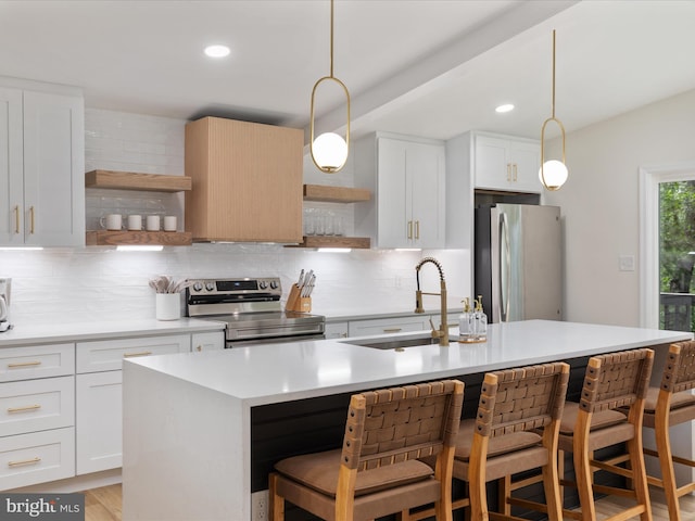 139 Laura Ct, Basye, VA 22810 - kitchen featuring open shelves, appliances with stainless steel finishes, a sink, backsplash, and light countertops