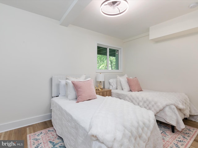 139 Laura Ct, Basye, VA 22810 - bedroom featuring wood finished floors, beamed ceiling, and baseboards
