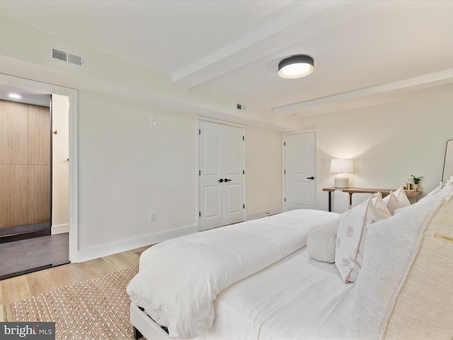 139 Laura Ct, Basye, VA 22810 - bedroom with light wood finished floors, beam ceiling, and baseboards