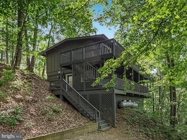 139 Laura Ct, Basye, VA 22810 - rear view of house with a deck, board and batten siding, and stairs