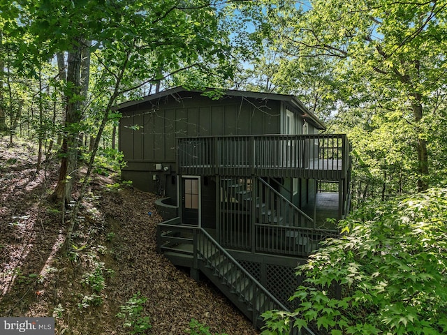 139 Laura Ct, Basye, VA 22810 - view of front of property featuring stairway, a deck, and board and batten siding