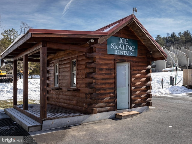 139 Laura Ct, Basye, VA 22810 - snow covered property entrance with log exterior