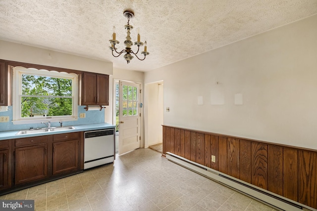 320 Dawn Ave, Woodstock, VA 22664 - kitchen with white dishwasher, a baseboard heating unit, a sink, a chandelier, and light countertops