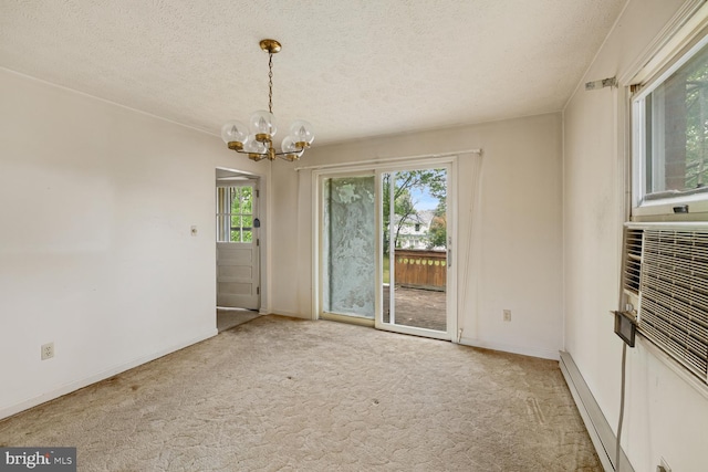 320 Dawn Ave, Woodstock, VA 22664 - unfurnished dining area with a chandelier, carpet floors, healthy amount of natural light, a textured ceiling, and baseboards
