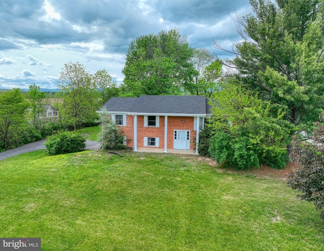 320 Dawn Ave, Woodstock, VA 22664 - view of front facade featuring brick siding, a front lawn, and roof with shingles