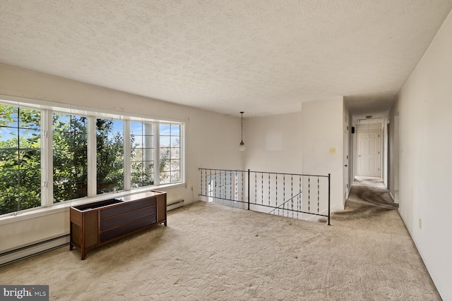 320 Dawn Ave, Woodstock, VA 22664 - empty room with carpet, a textured ceiling, and a baseboard radiator