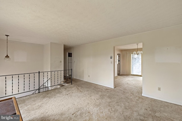 320 Dawn Ave, Woodstock, VA 22664 - unfurnished room featuring a textured ceiling, carpet floors, baseboards, and a chandelier