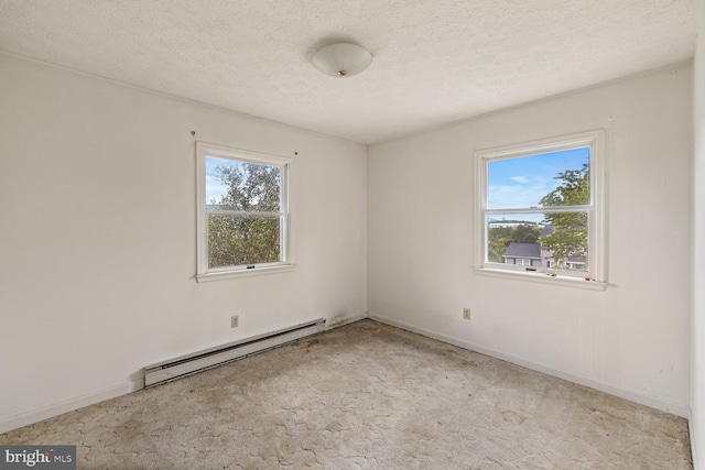 320 Dawn Ave, Woodstock, VA 22664 - empty room featuring a baseboard radiator, healthy amount of natural light, carpet, and a textured ceiling