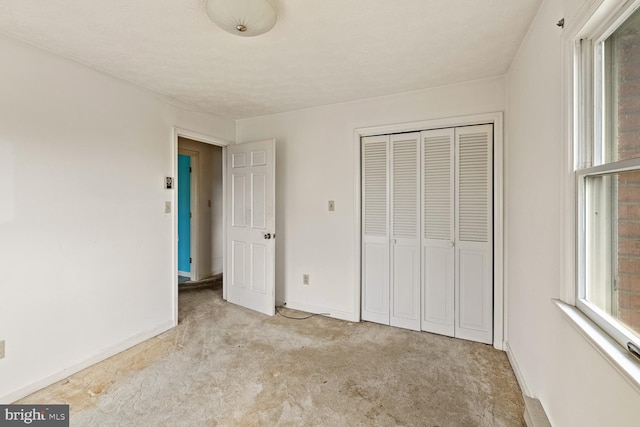 320 Dawn Ave, Woodstock, VA 22664 - unfurnished bedroom with carpet, a closet, and baseboards