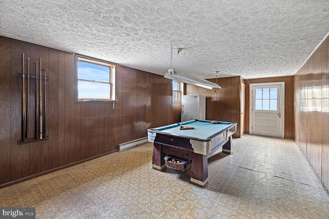320 Dawn Ave, Woodstock, VA 22664 - game room featuring baseboard heating, pool table, light floors, wooden walls, and a textured ceiling