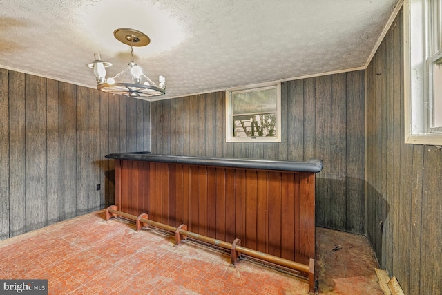 320 Dawn Ave, Woodstock, VA 22664 - indoor dry bar with a textured ceiling, a chandelier, and wood walls