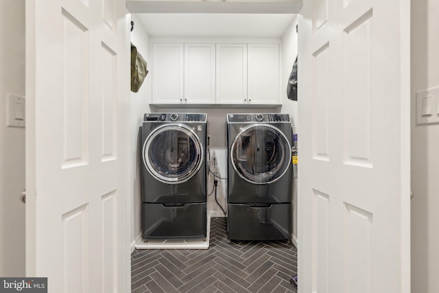 11013 Homeplace Ln, Potomac, MD 20854 - washroom with washing machine and clothes dryer, cabinet space, baseboards, and brick patterned flooring