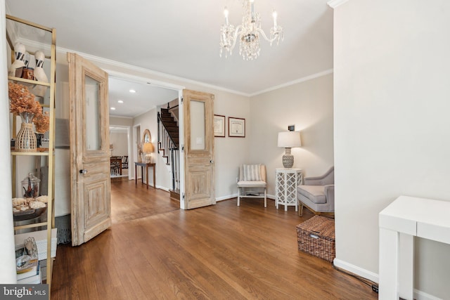 11013 Homeplace Ln, Potomac, MD 20854 - sitting room with wood finished floors, a chandelier, stairs, baseboards, and ornamental molding