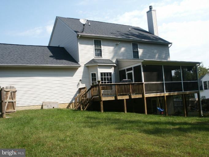 11612 Hoover Ln, Fredericksburg, VA 22407 - back of property featuring a sunroom, a chimney, a yard, and a wooden deck