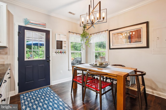 dining space with a chandelier, dark wood-style flooring, baseboards, and crown molding