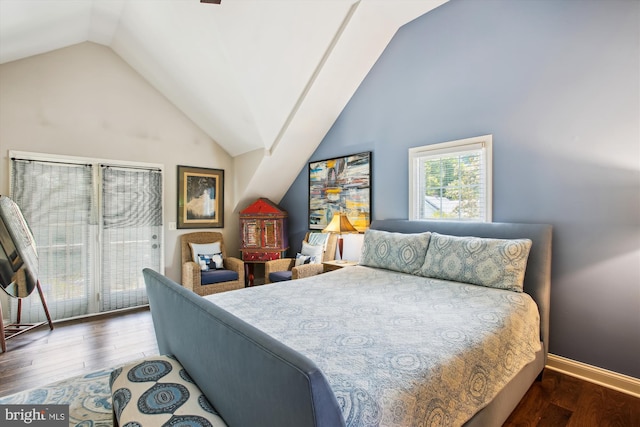 bedroom featuring wood finished floors, access to exterior, baseboards, and high vaulted ceiling