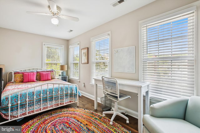 bedroom with baseboards, wood finished floors, and ceiling fan